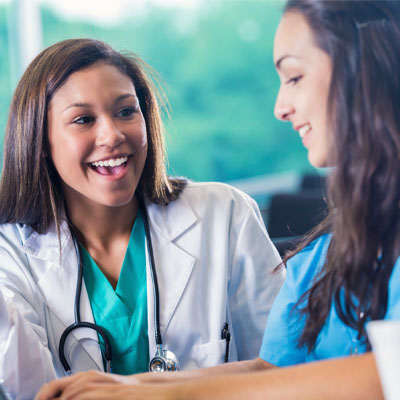 Two students of colon hydrotherapy training